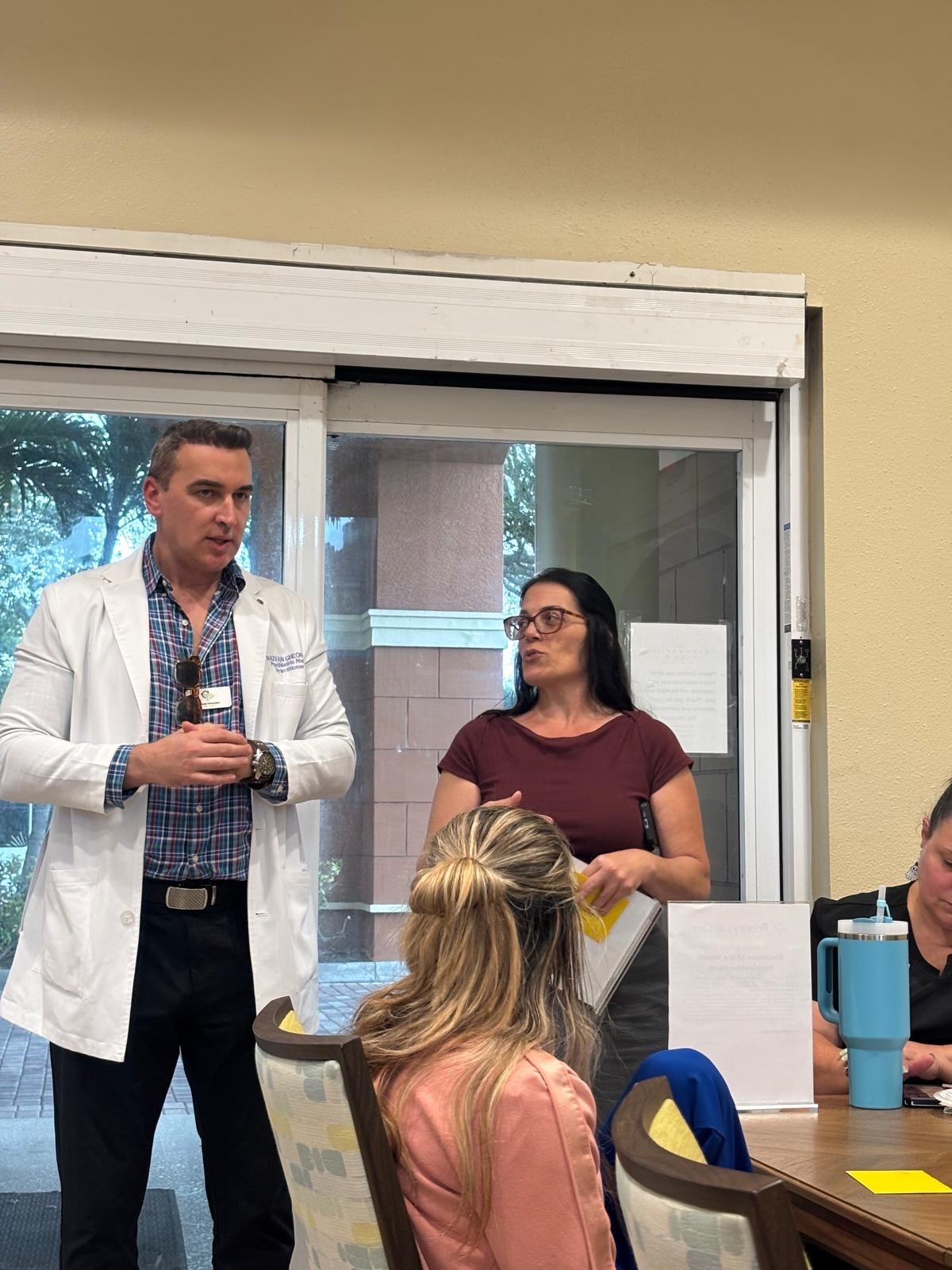 Razvan Gheorghe speaking with ALF staff member during dementia talk
