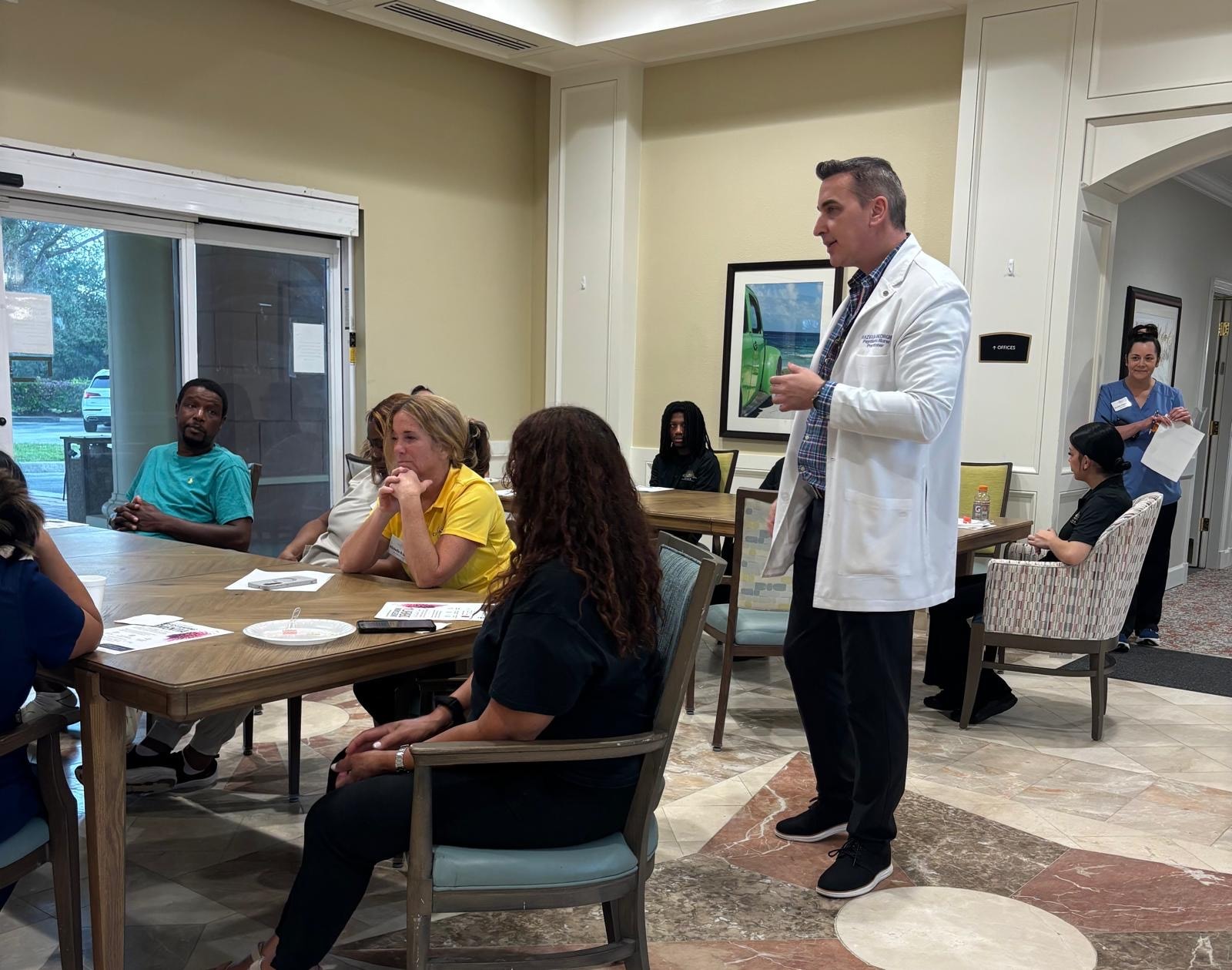 Razvan Gheorghe engaging with ALF caregivers about dementia care